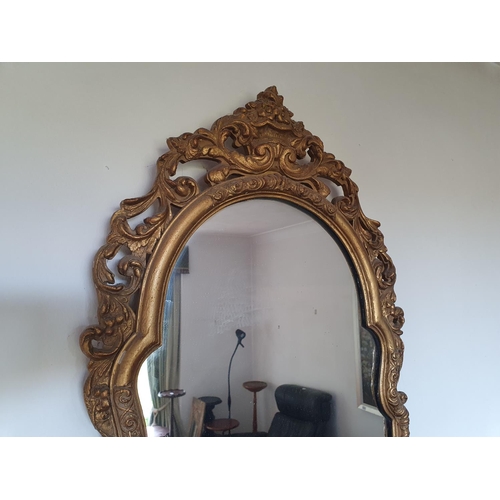 223 - A wall mirror, in a gilt frame, 100 x 44 cm, and another similar, 67 x 39 cm (2)