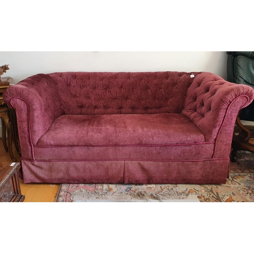 235 - A button back upholstered Chesterfield style settee, approx. 176 cm wide, and a group of cushions