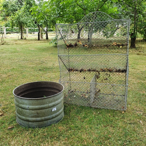 39 - A galvanised metal garden produce holder, 61 cm wide and a galvanised metal garden pot, 41 cm diamet...