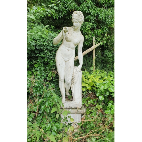 40 - A reconstituted stone figure of Pomona, on a base, approx. 210 cm high...