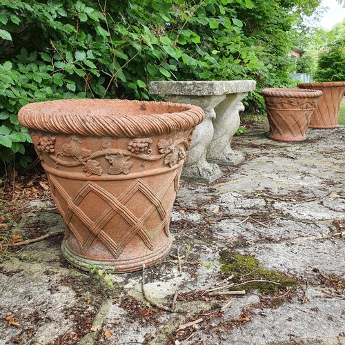 42 - A pair of terracotta garden pots, with lattice work style decoration, approx. 48 cm high...
