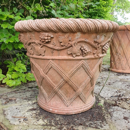42 - A pair of terracotta garden pots, with lattice work style decoration, approx. 48 cm high...