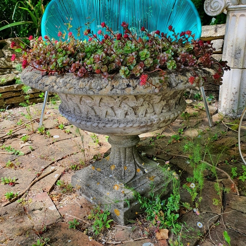 47 - A reconstituted stone garden urn, approx. 60 cm high, planted with succulents...
