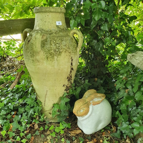 49 - A pottery amphora vase, 72 cm high, and an earthenware garden rabbit (2)...