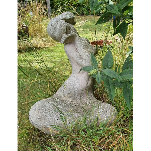 55 - A large reconstituted stone garden figure, of a nude lady, seated, with her head resting in a hand, ...