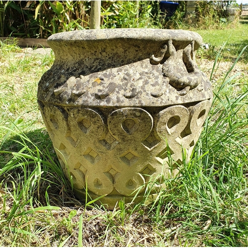 58 - A reconstituted stone garden urn, approx. 32 cm high...