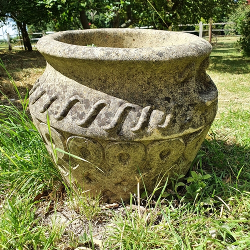 58 - A reconstituted stone garden urn, approx. 32 cm high...