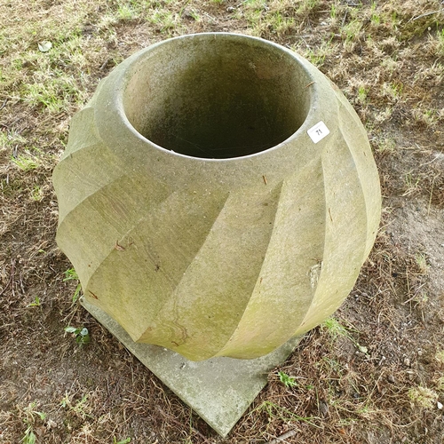 71 - A contemporary carved stone/marble urn, of twisted form, approx. 52 cm high