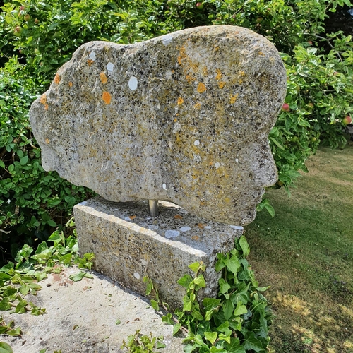 73 - A carved stone garden ornament, in the form of a lady's head, with her hair flowing behind, approx. ... 