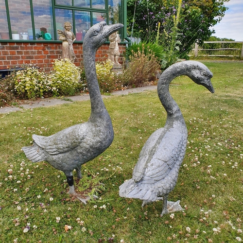 82 - A large blue glazed garden pot, approx. 36 cm high, and a pair of silver painted geese ornaments (3)