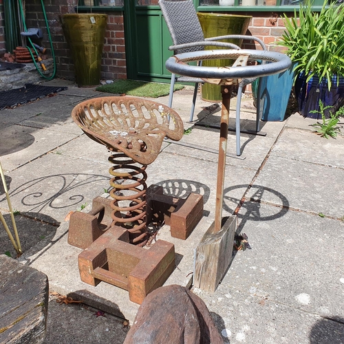 85 - A tractor seat, mounted on a spring, two garden chairs, a garden low table, assorted garden pots and... 