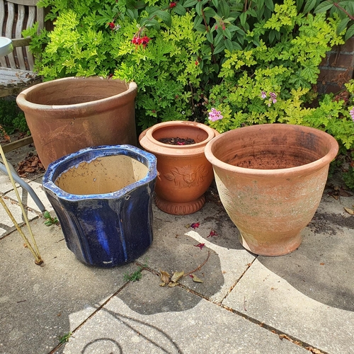 85 - A tractor seat, mounted on a spring, two garden chairs, a garden low table, assorted garden pots and... 