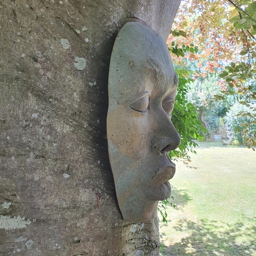 97 - A pottery face mask garden ornament, approx. 49 cm high (hanging on the Beech tree)