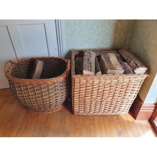 255 - The Dining Room.
A wicker log basket, 60 cm wide, and another similar, 57 cm wide, with some logs