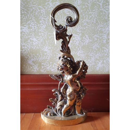 257 - A brass door porter, in the form of a cherub, 49 cm high