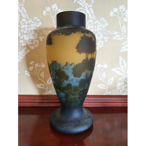 264 - A Gallé style cameo glass vase, decorated trees and foliage, 33.5 cm high