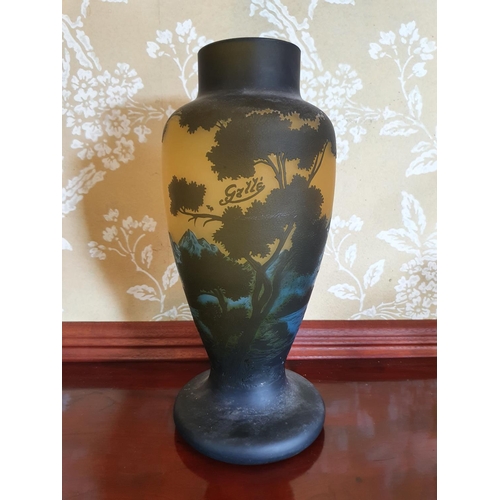 264 - A Gallé style cameo glass vase, decorated trees and foliage, 33.5 cm high