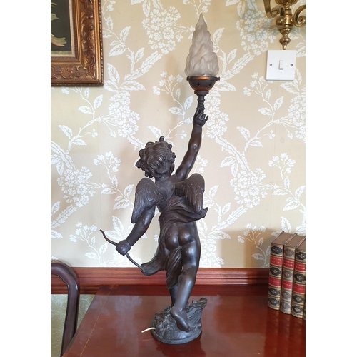 271 - A spelter cherub lamp, repaired at the knee, with a flambeau glass finial, 72 cm high (overall), nee... 