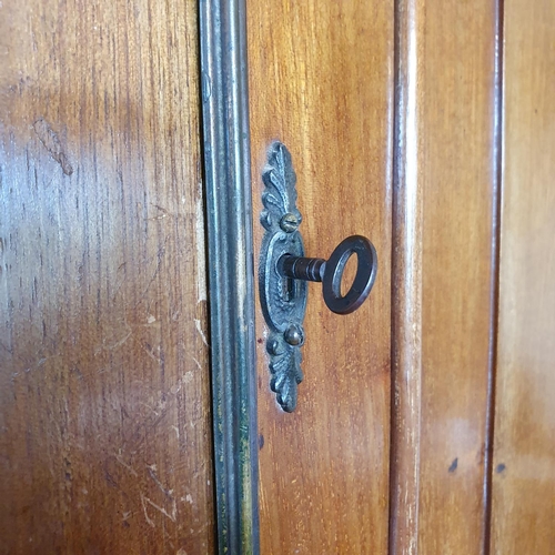 274 - A mahogany floor standing corner cupboard, having two pairs of panel doors, approx. 108 cm wide