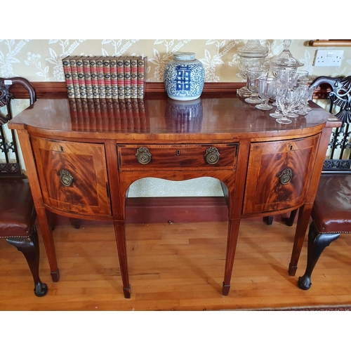 277 - A 19th century inlaid mahogany sideboard, with a bow front central section having three drawers, on ... 