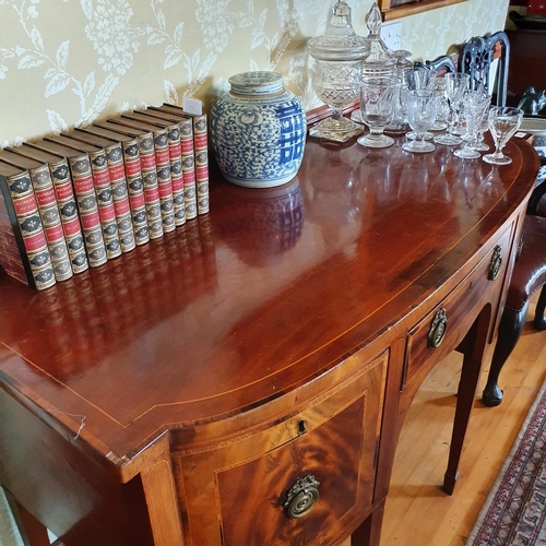 277 - A 19th century inlaid mahogany sideboard, with a bow front central section having three drawers, on ... 