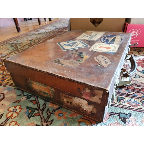 310 - A leather suitcase, with old labels, 35 cm wide, assorted ceramics, glass and other items (qty)