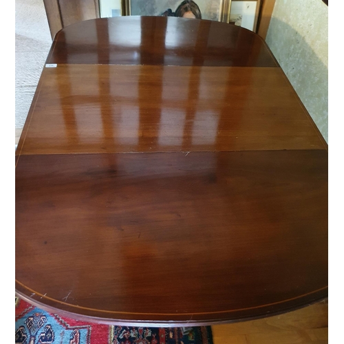 317 - An Edwardian mahogany drop leaf dining table, with boxwood stringing, 136 cm wide