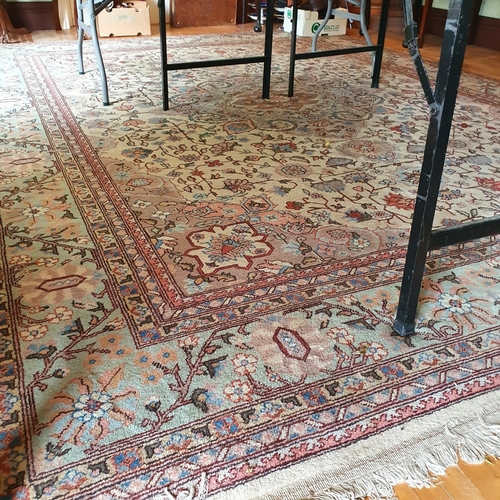 321 - A Persian style carpet, the central ground decorated scrolling foliage, 277 x 363 cm