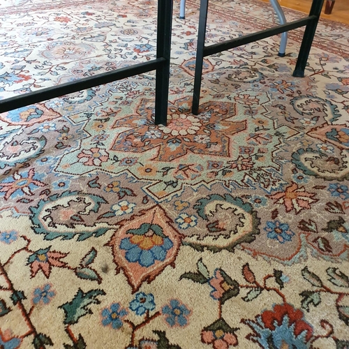 321 - A Persian style carpet, the central ground decorated scrolling foliage, 277 x 363 cm