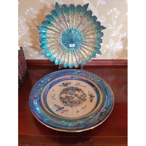 323 - An Alvin Irving Lancaster Pottery charger, decorated brambles, 45.5 cm diameter, and an art glass su... 