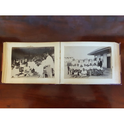 328 - A late 19th/early 20th century photograph album, including topographical views, and African cricket ... 