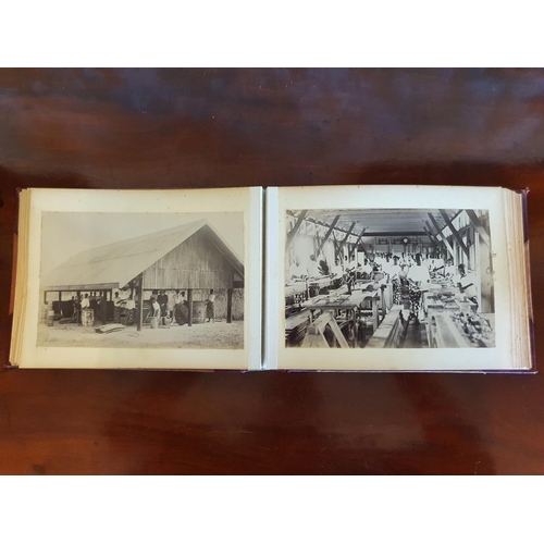 328 - A late 19th/early 20th century photograph album, including topographical views, and African cricket ... 