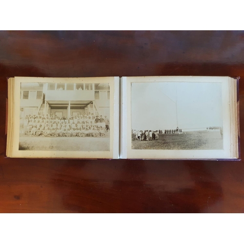 328 - A late 19th/early 20th century photograph album, including topographical views, and African cricket ... 