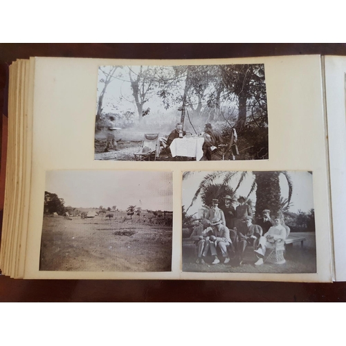 328 - A late 19th/early 20th century photograph album, including topographical views, and African cricket ... 