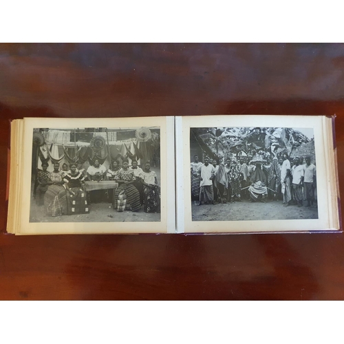 328 - A late 19th/early 20th century photograph album, including topographical views, and African cricket ... 