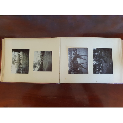 328 - A late 19th/early 20th century photograph album, including topographical views, and African cricket ... 