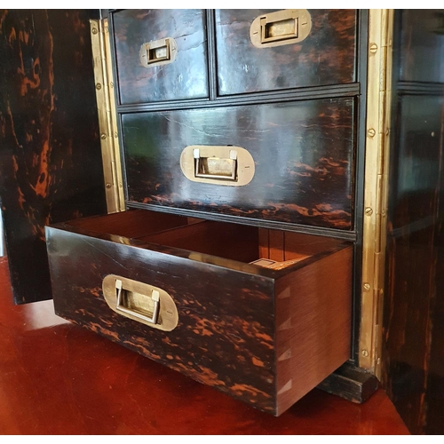 337 - A late Victorian coromandel wood chest, having two doors opening to reveal four drawers, 29.5 cm wid... 