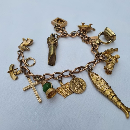 352 - A 9ct gold charm bracelet, with assorted charms, 42.7 g (all in)