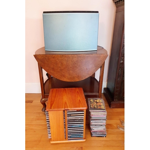 357 - A Bang & Olufsen radio/CD player, cannot get this to power up, assorted CDs, and a walnut trolley