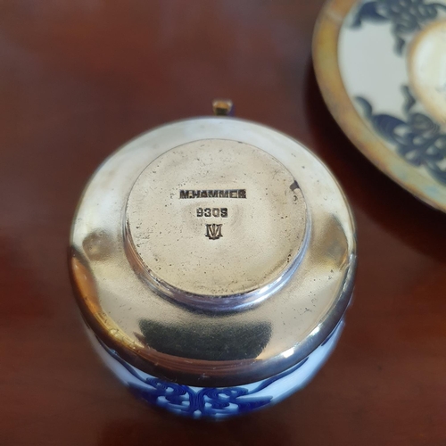 397 - A M. Hammer silver coloured metal and enamel cup and saucer