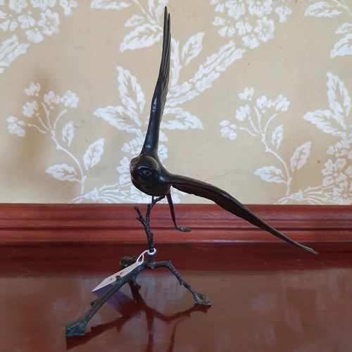 411 - A Pat Northcroft bronze figure of a swallow, 1/150, 24 cm high