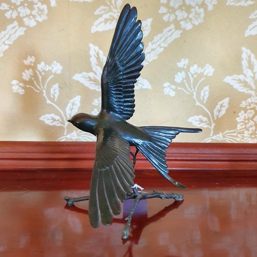 411 - A Pat Northcroft bronze figure of a swallow, 1/150, 24 cm high