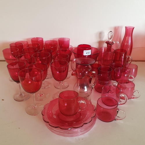 414 - A large group of assorted cranberry and ruby glass wares