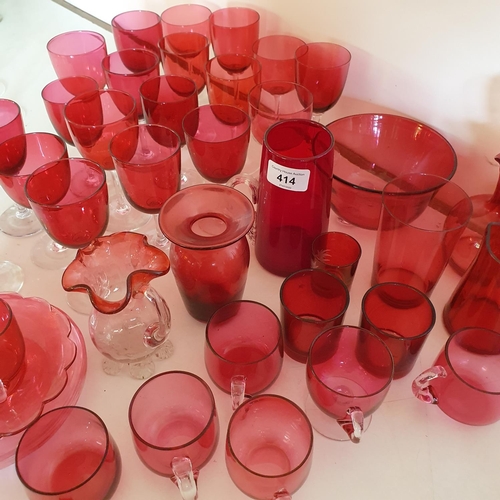 414 - A large group of assorted cranberry and ruby glass wares