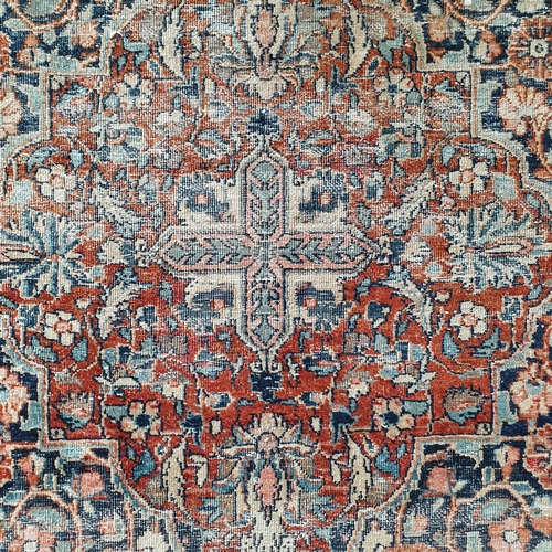 430 - A Persian rug, with a central medallion, 200 x 130 cm