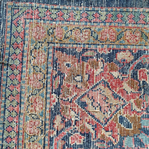 430 - A Persian rug, with a central medallion, 200 x 130 cm