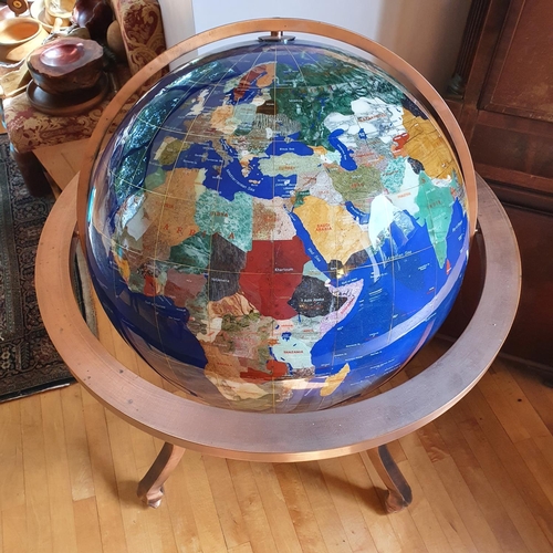 449 - A large library type modern globe, approx. 68 cm diameter, in a copper stand/frame, approx. 105 cm h... 