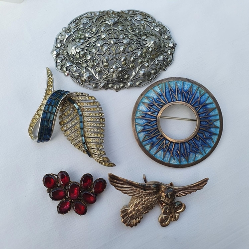 519 - A 19th century garnet brooch, a silver coloured metal and enamel brooch, and other brooches