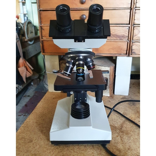 128 - An elecric laboratory binocular microscope