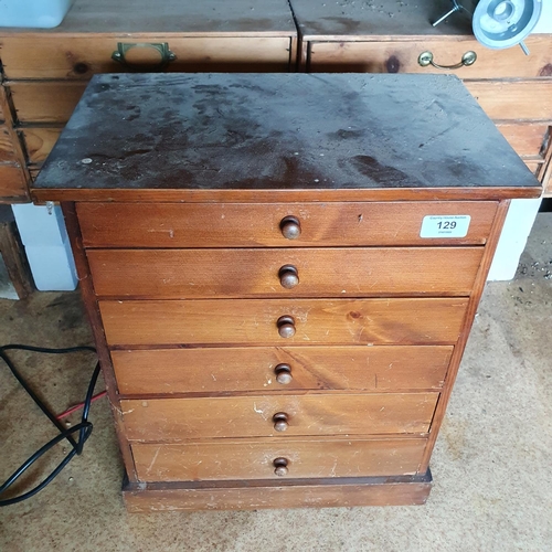 129 - A collector's type chest, of six drawers, with contents of screws, 38.5 cm wide, and four other offi... 